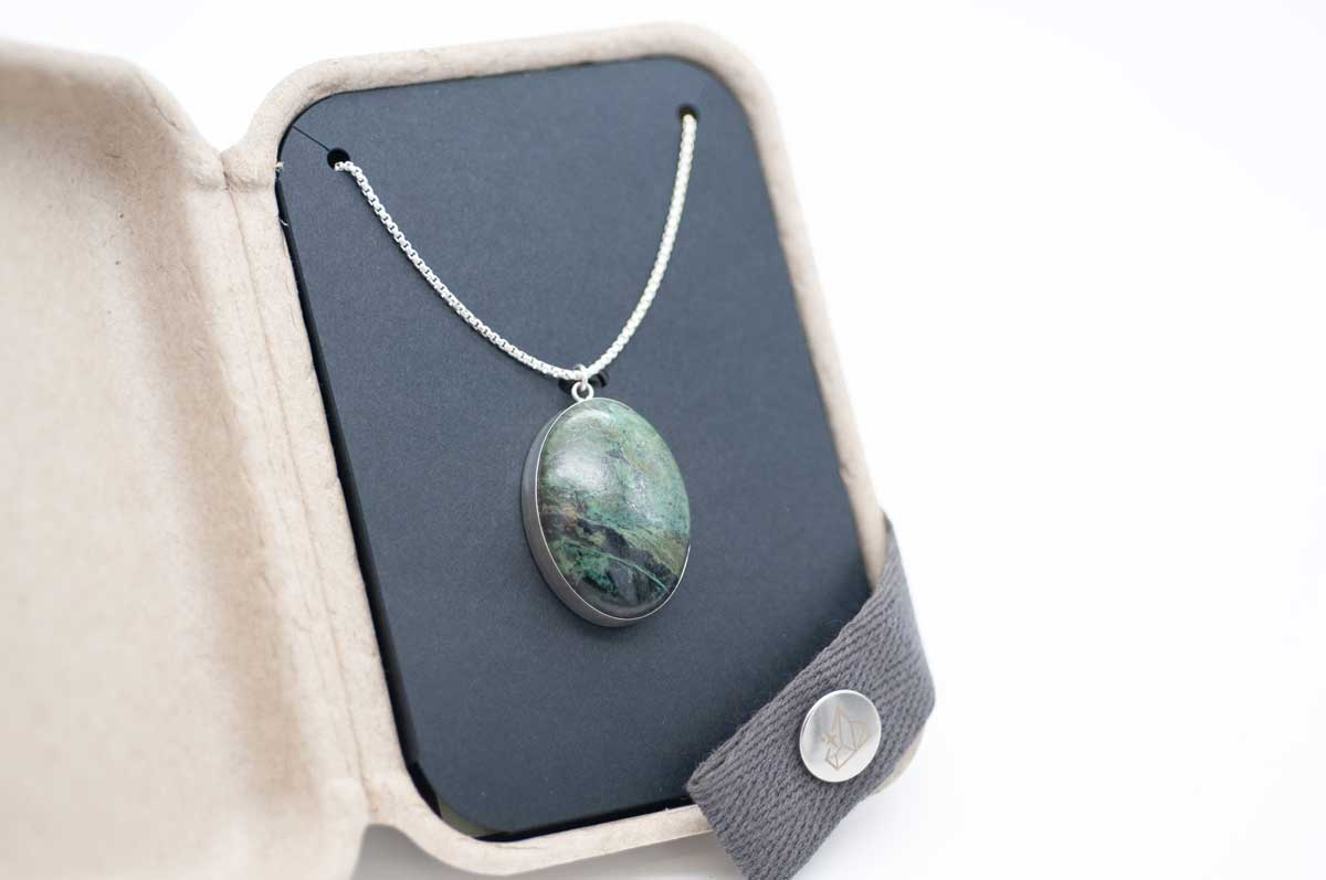 Custom-made statement necklace with a natural green stone set as a sterling silver pendant