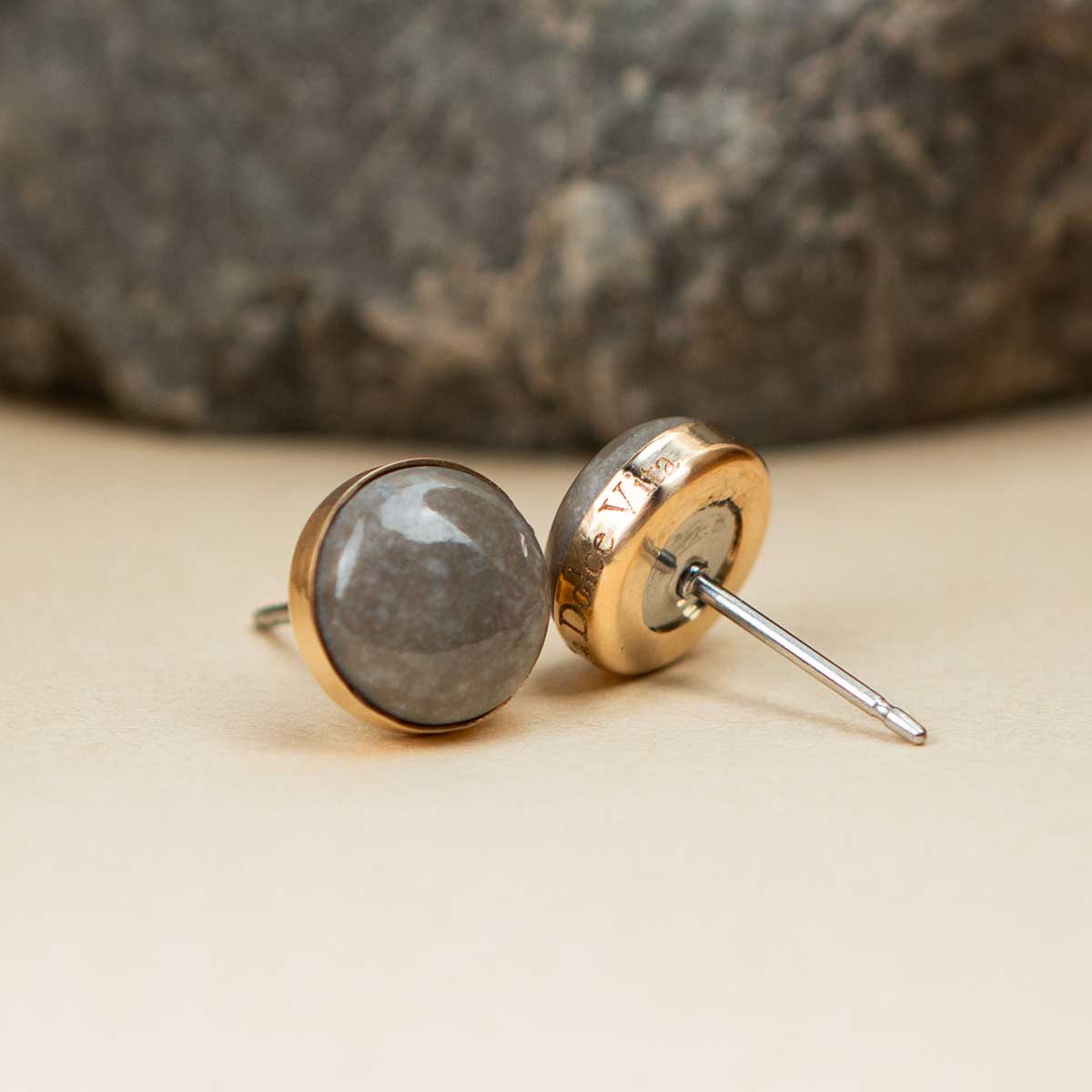 14k gold fill stud earrings set with a natural grey rock and custom engraved on the edge