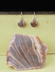 Pair of stone dangle earrings set in sterling silver with the rock they were made from