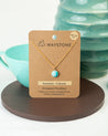 A small round pendant necklace made from natural Amazonite set in 14k gold fill
