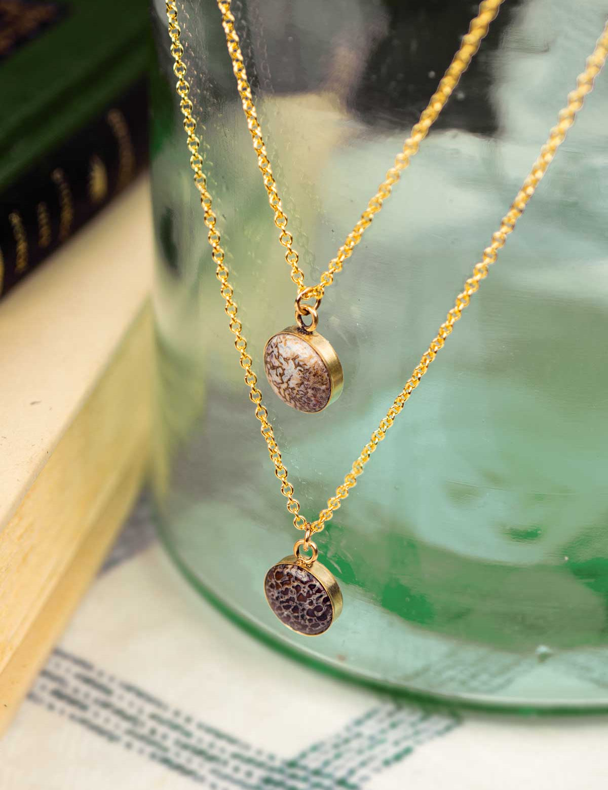 Two fossillized dinosaur bone necklaces made from 14k gold fill chain