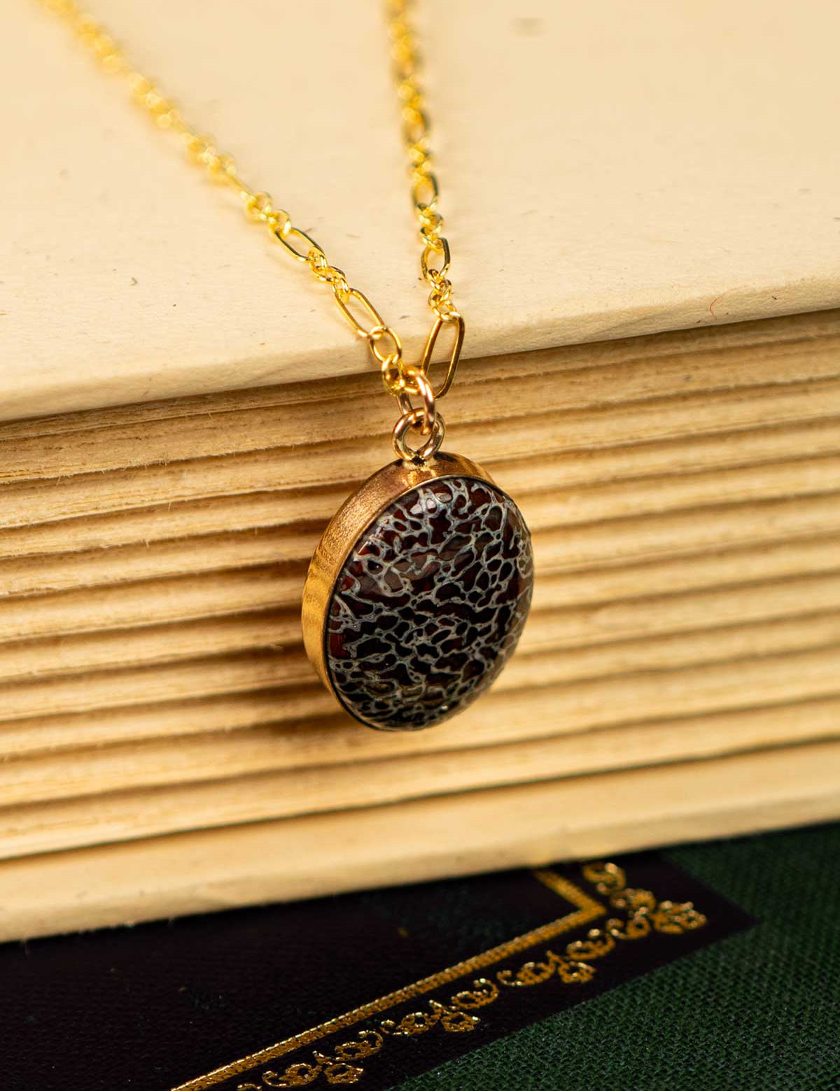 Pendant necklace made from fossilized dinosaur gembone set in 14k gold fill