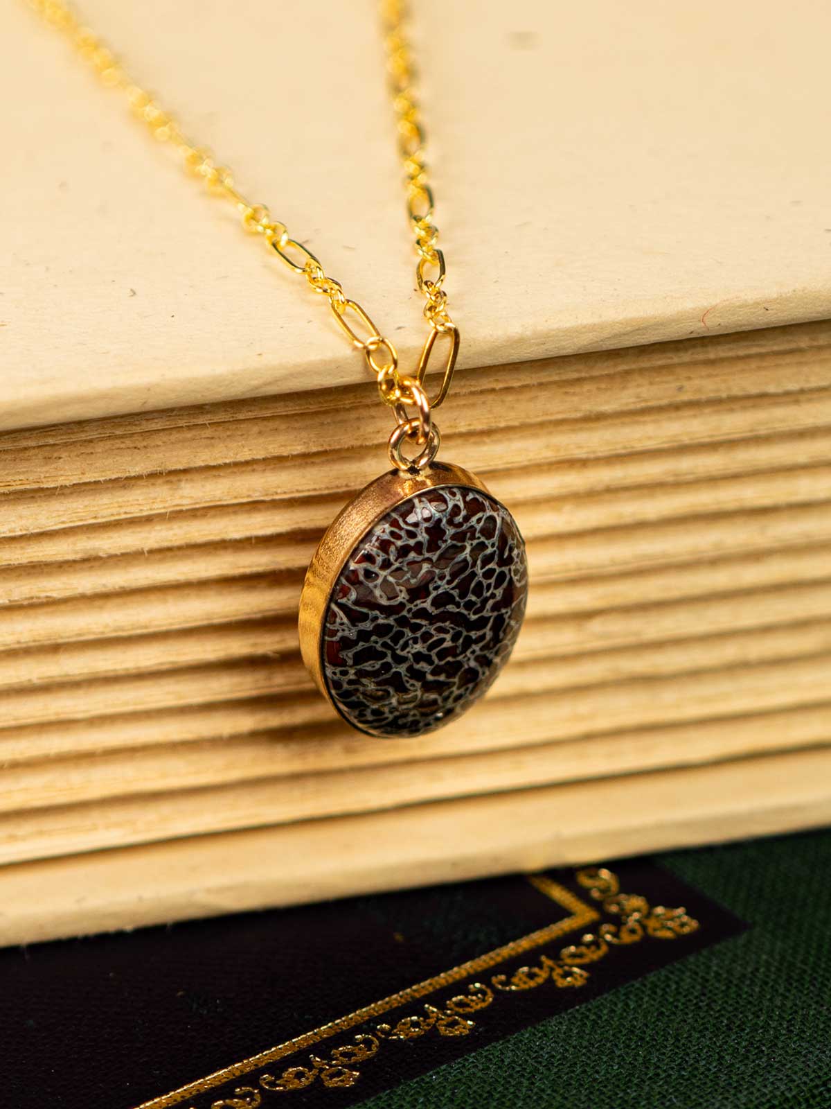 Pendant necklace made from fossilized dinosaur gembone set in 14k gold fill