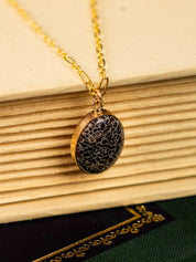 Pendant necklace made from fossilized dinosaur gembone set in 14k gold fill