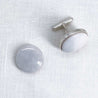 Side view with a pair of 16mm round white marble cufflinks