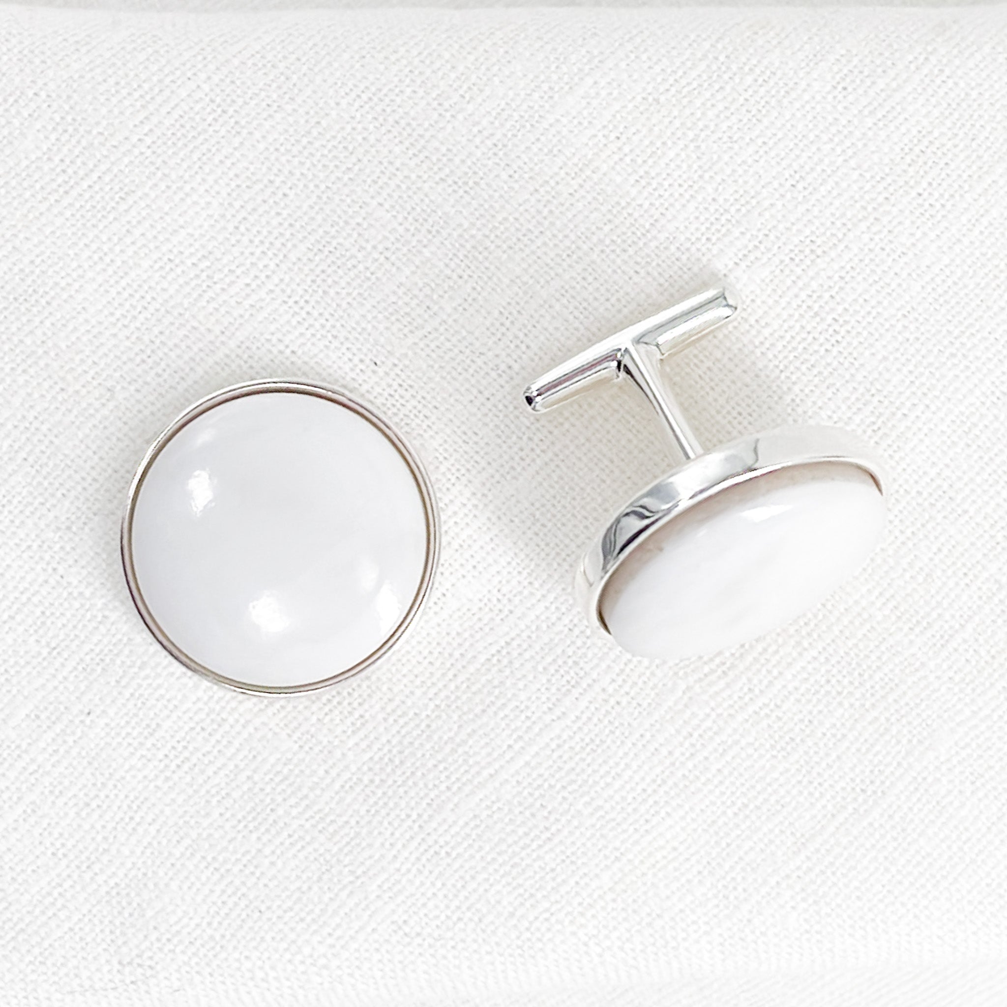 16mm white yule marble from marble Colorado, polished to a shine and set in sterling silver cufflinks