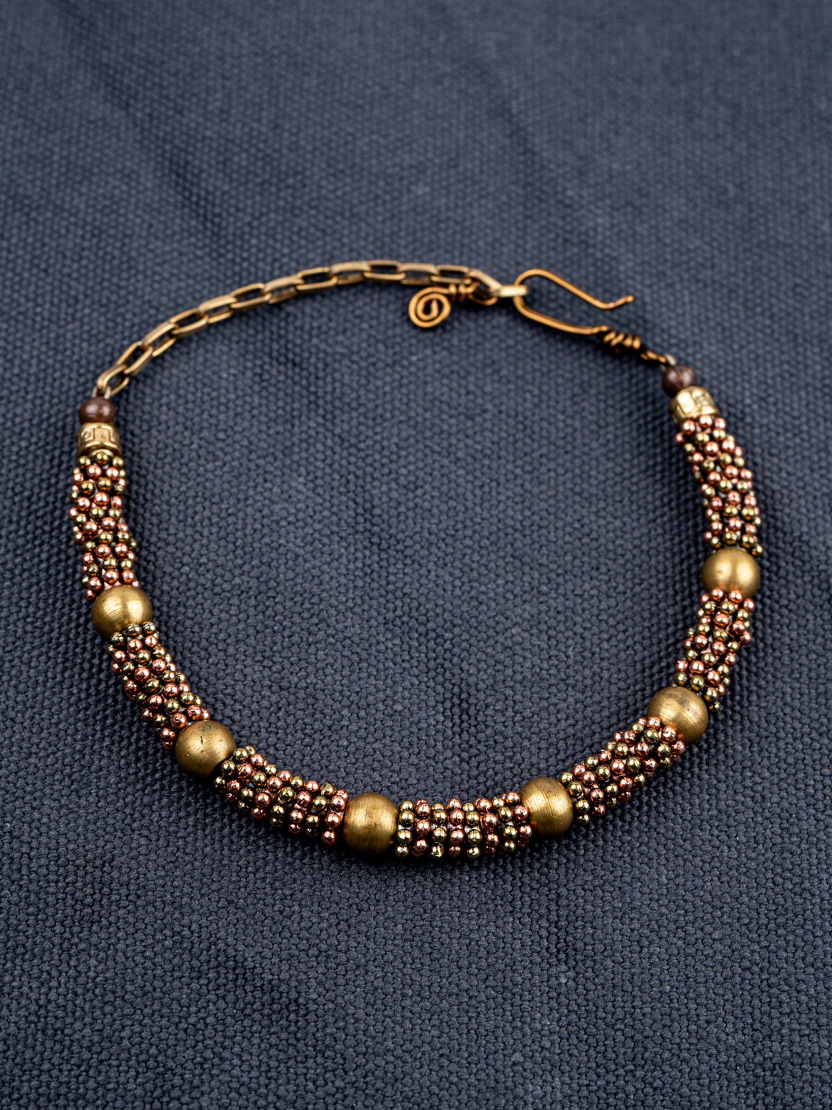 Sterling Silver chain bracelet on a gray fabric background