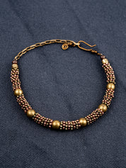 Sterling Silver chain bracelet on a gray fabric background