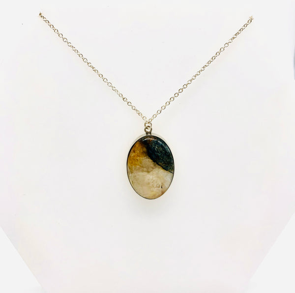 Natural stone set as an oval pendant necklace