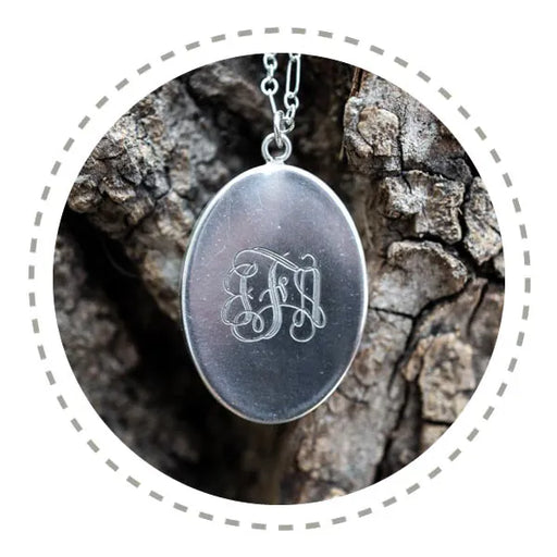 Sterling silver pendant necklace with a custom engraved monogram on the back