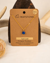Waystone Lapis Lazuli Compass Necklace on a brown card with gold chain