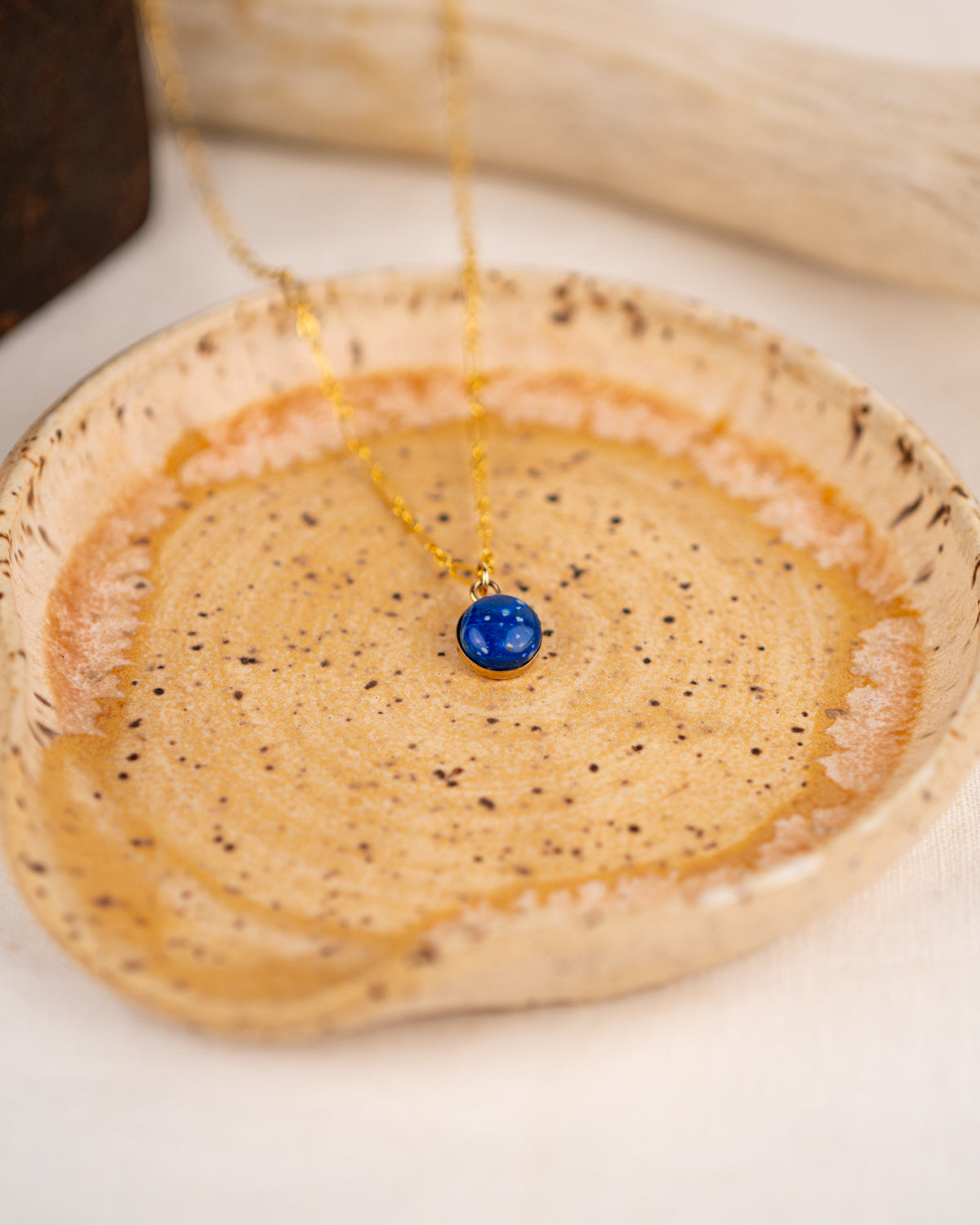 Necklace with a small blue lapis lazuli pendant