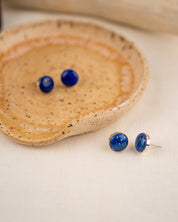 White-flecked lapis lazuli stud earrings with sterling silver settings