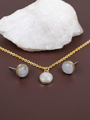 Gold chain with a round stone pendant and matching stud earrings set in gold fill