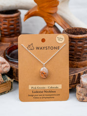 12x16 mm oval-shaped Pink Granite, polished to a shine and set in sterling silver