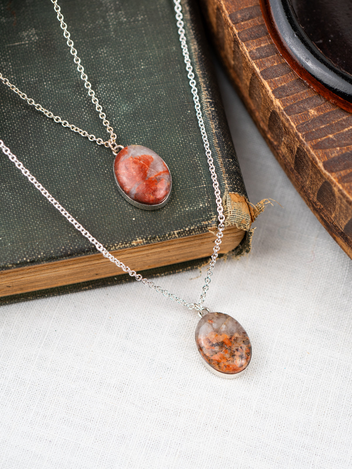 Necklace with a pendant on an open book