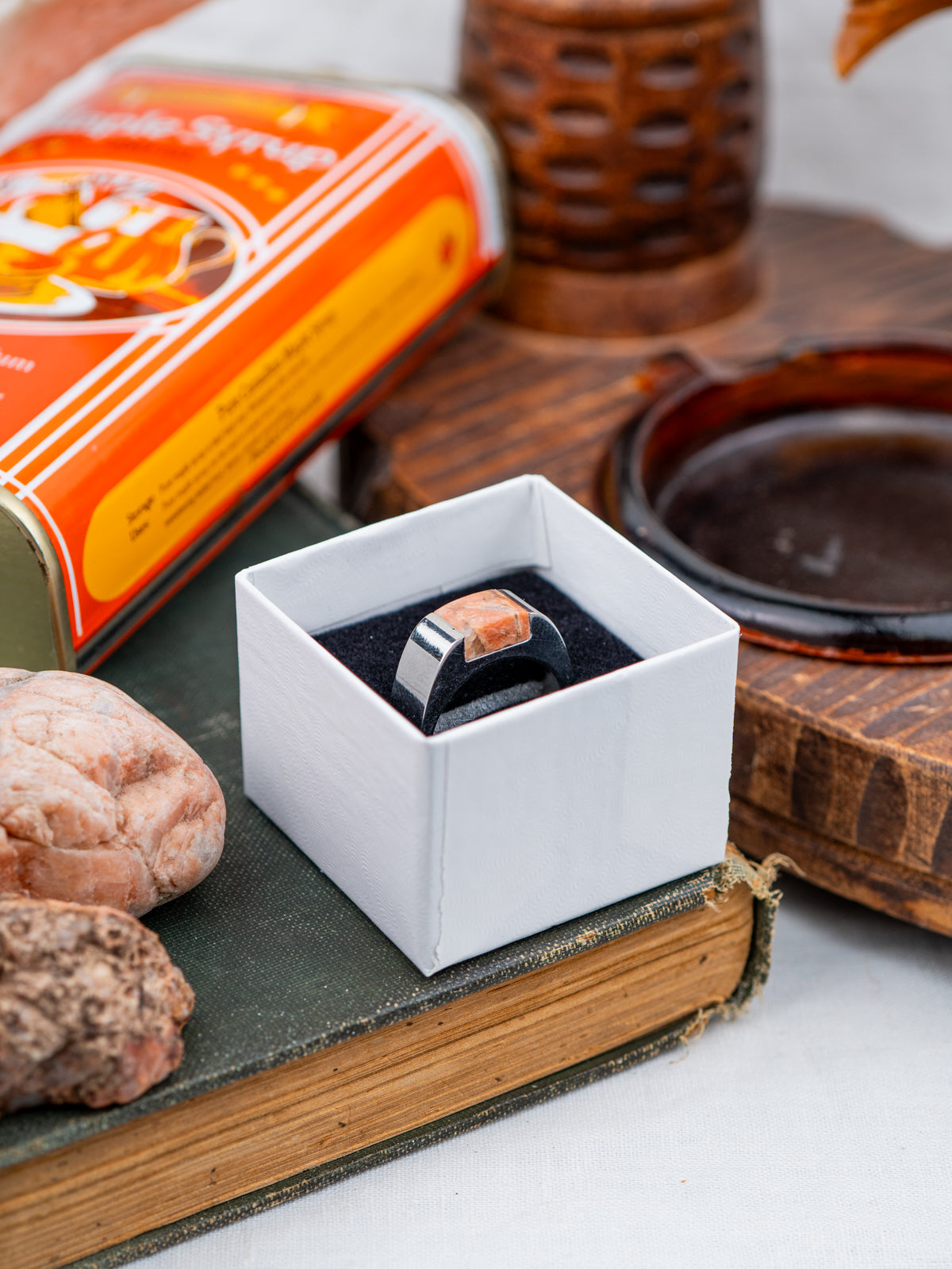 Rectangle-shaped Pink Granite, polished to a shine and set in a stainless steel ring