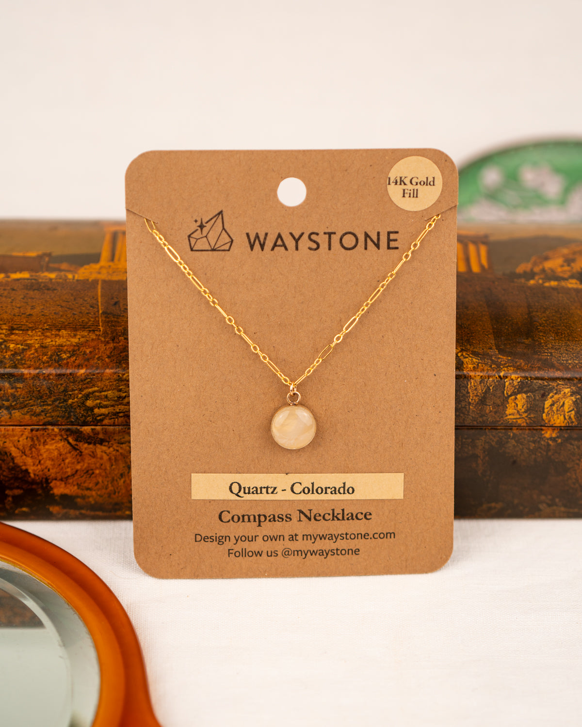 White colored milky quartz set into 14K Gold Fill pendant on a Waystone branded card