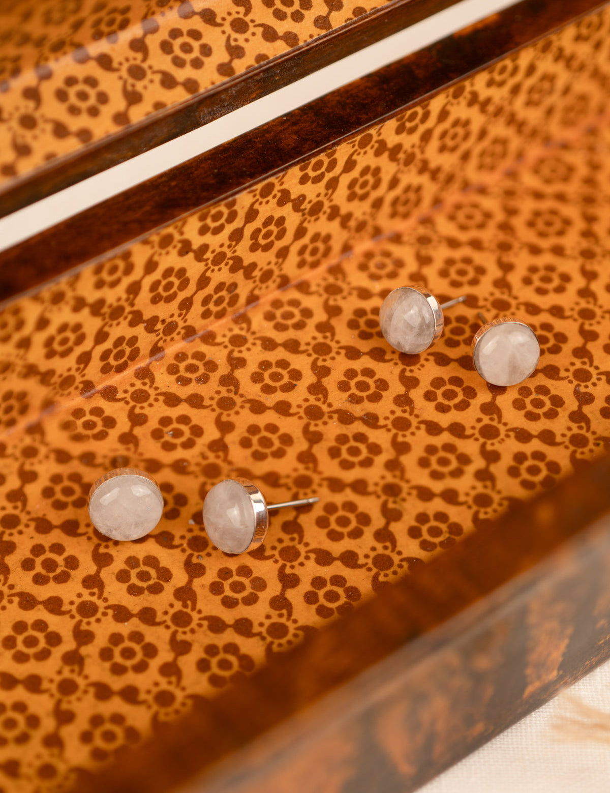 Two sets of white colored milky quartz in an orange box