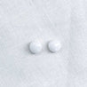 Front view with a pair of 8mm round white marble stud earrings
