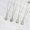 four voyager charm necklaces with state outline designs. Tennessee, Pennsylvania, Oregon, and Adventure back charms pictured