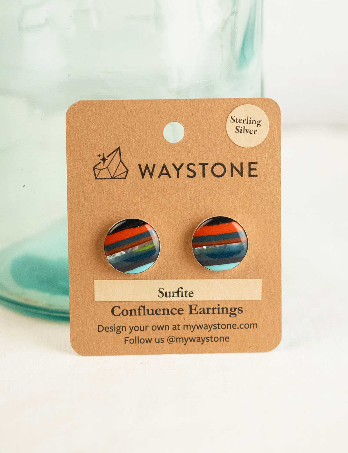 16 mm round upcycled surfite, polished to a shine and set in sterling silver studs 