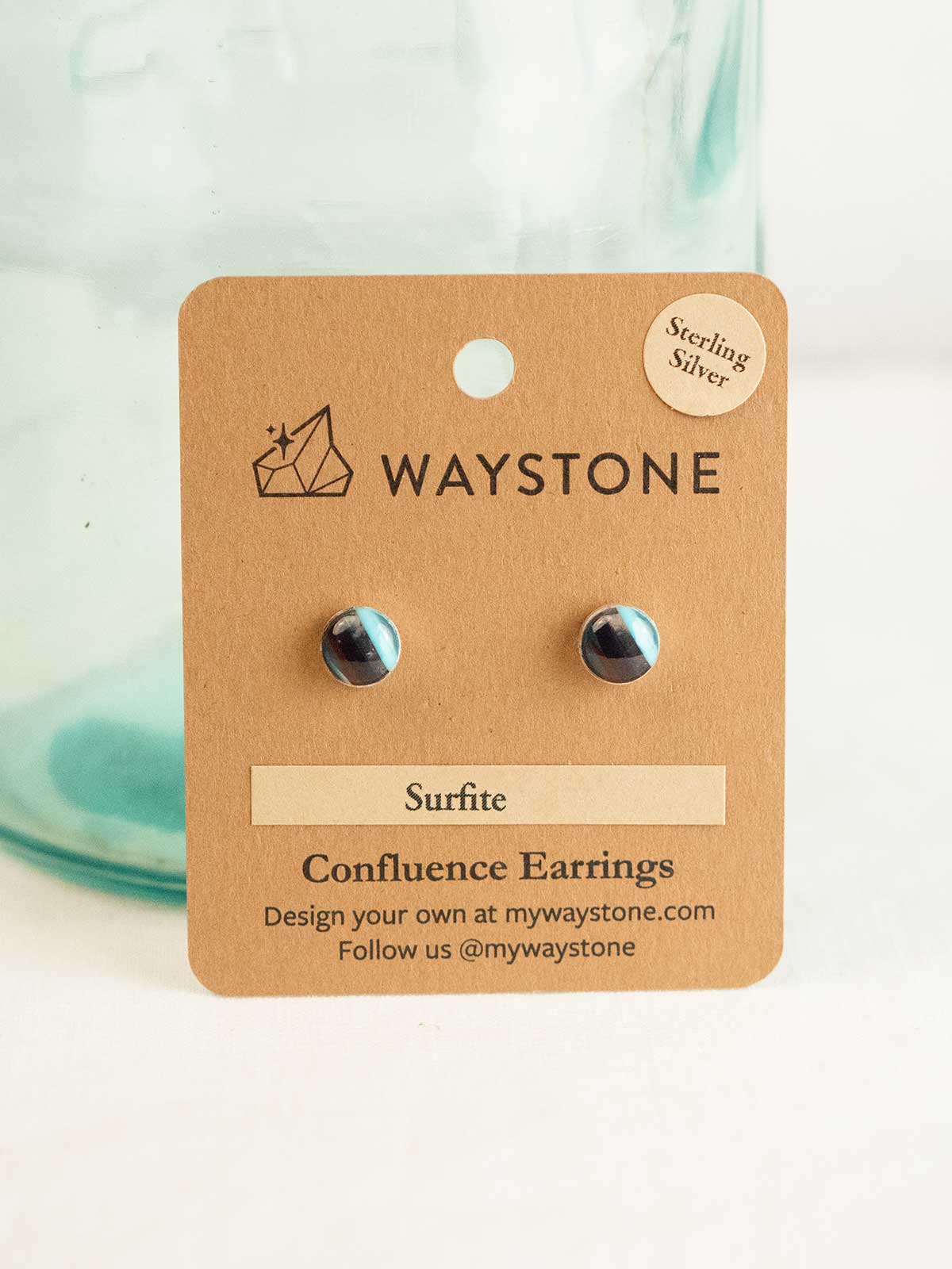 8 mm round upcycled surfite, polished to a shine and set in sterling silver studs 