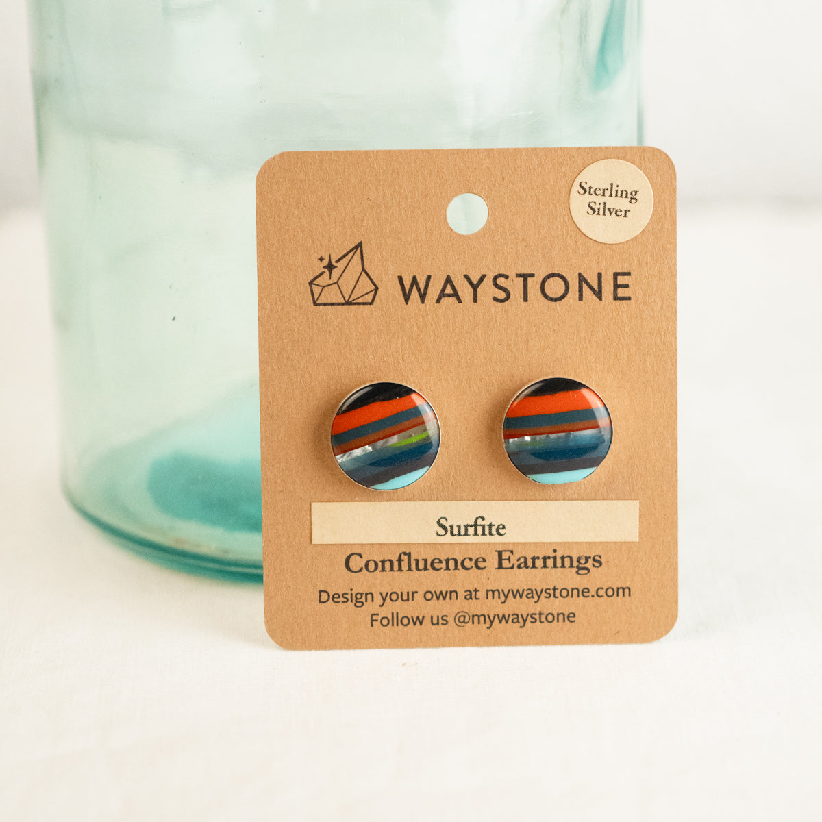 16 mm round upcycled surfite, polished to a shine and set in sterling silver studs 