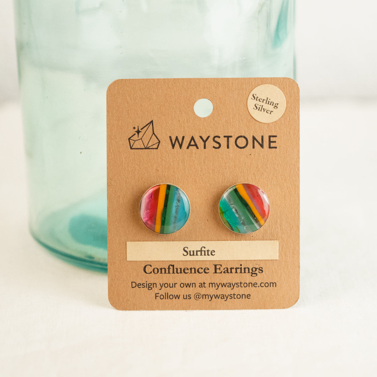 16 mm round upcycled surfite, polished to a shine and set in sterling silver studs 