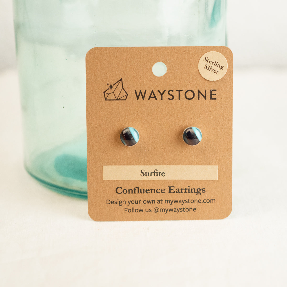 8 mm round upcycled surfite, polished to a shine and set in sterling silver studs 