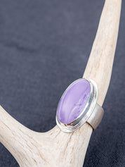Sterling silver ring featuring a Tiffany stone with natural purple tones on a pale antler