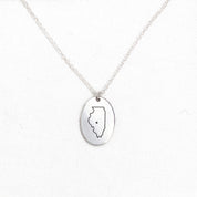 a voyager charm necklace with an Illinois artwork engraving
