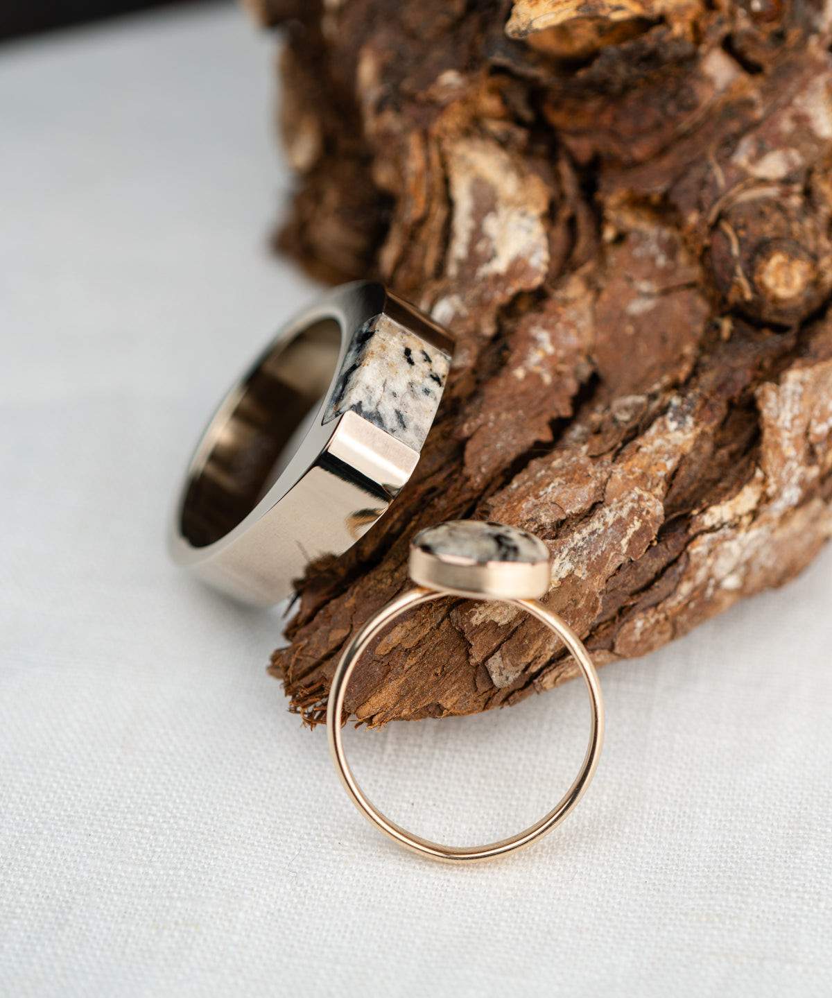 Two rings, one masculine and one feminine, made from the same granite rock