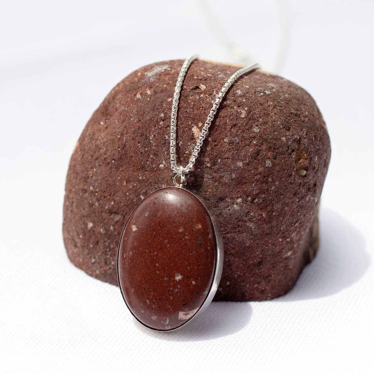Natural red stone turned into statement pendant necklace with sterling silver chain
