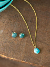 Amazonite stud earrings with a 14k gold fill setting and a matching small round pendant necklace on a gold chain
