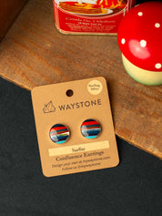 Waystone striped surfite earrings on a cardboard card