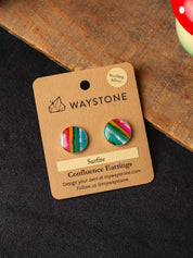 Large Surfite stud earrings with pink, teal, and green stripes