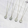 four voyager charm necklaces with zodiac constellations.  Sagittarius,  Virgo, Gemini, and Aquarius charms pictured